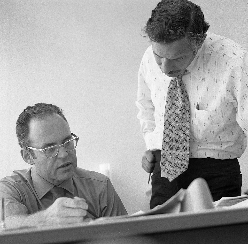Gordon Moore, seated, with Robert Noyce at Intel in 1970